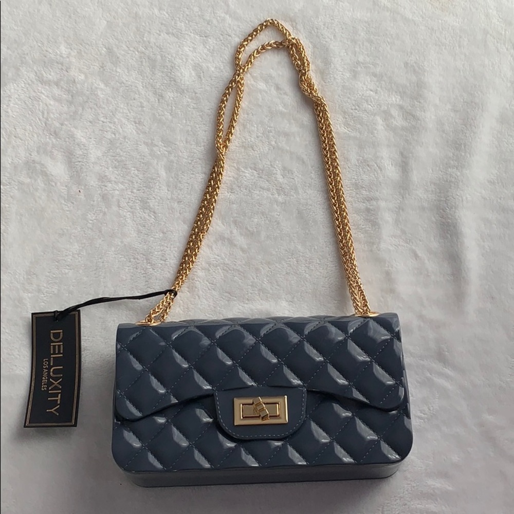 Gray jelly bag with chain handle quilted pattern